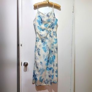 Floral satin dress with lace shoulder straps.